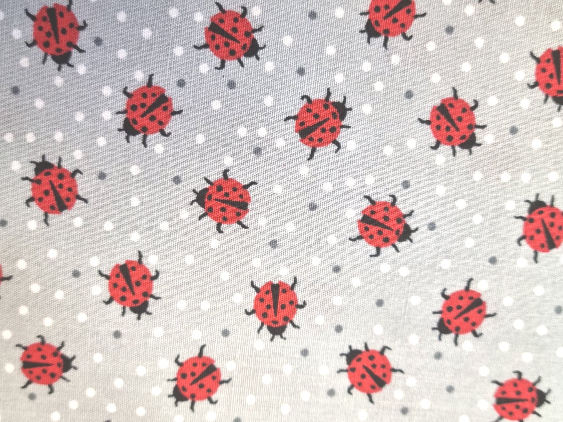 Grey background with ladybird design 100% cotton